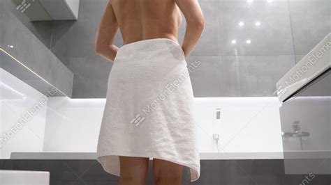 woman drops towel